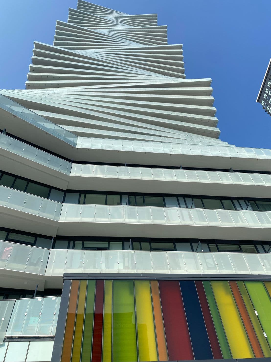 Modern high-rise tower with a twisting architectural façade